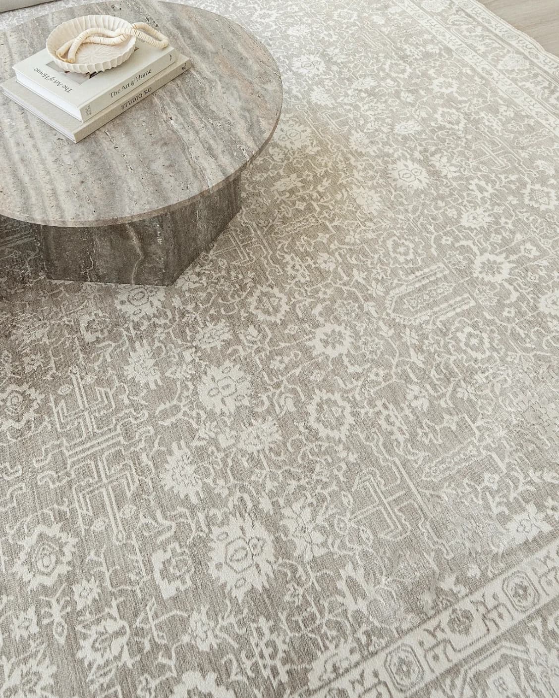 Natalia Sandy carpet in beige and grey, shown in a lifestyle top view as image 9