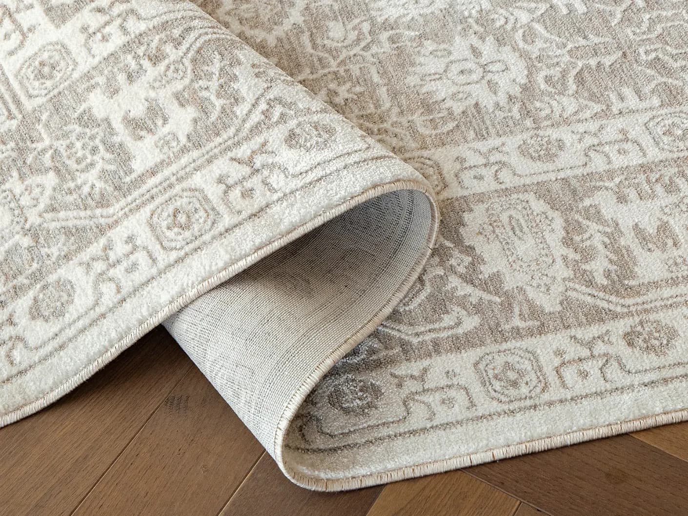 Natalia Sandy carpets in sandy, beige and grey, shown in a product close-up view