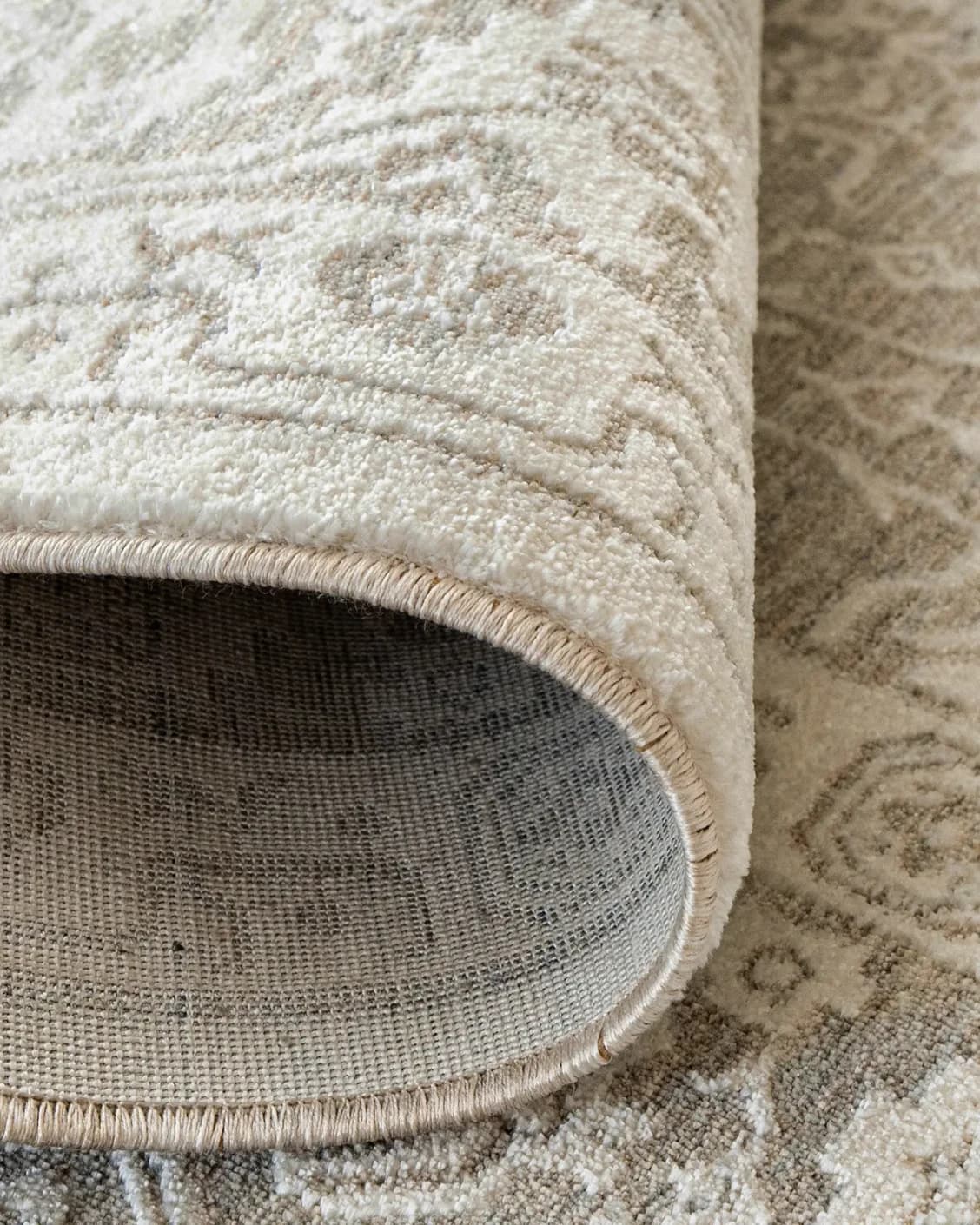 Natalia Sandy carpet in beige and grey, shown in a product close-up as image 12