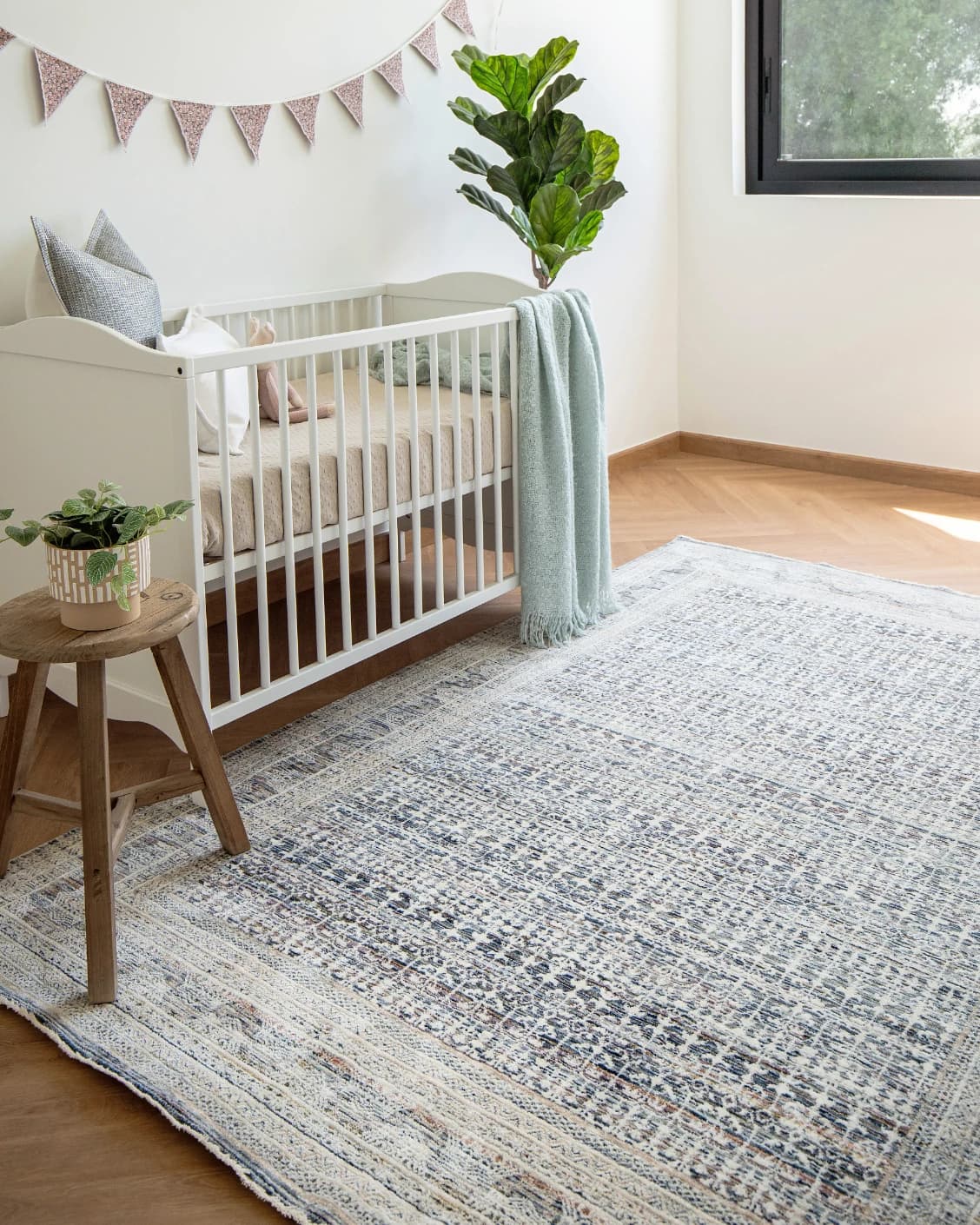 Natalia Sky carpet in blue, shown in a lifestyle left view as image 7