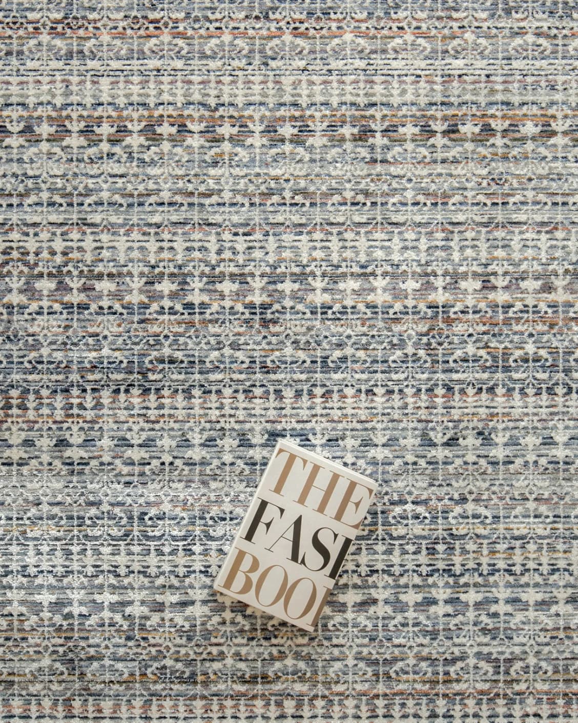 Natalia Sky carpet in blue, shown in a lifestyle top view as image 8