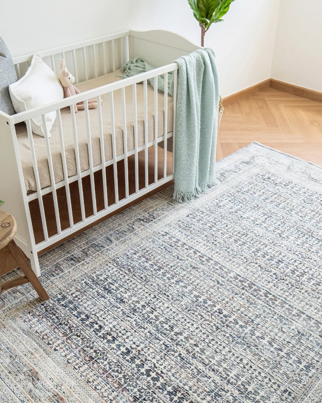 Natalia Sky carpet in blue, shown in a lifestyle top view as image 9