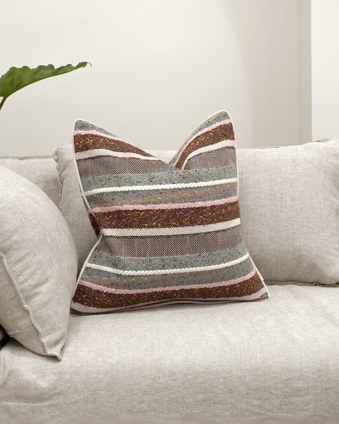 Naysa Alecia cushion in multicolour, shown in a lifestyle front view as image 2