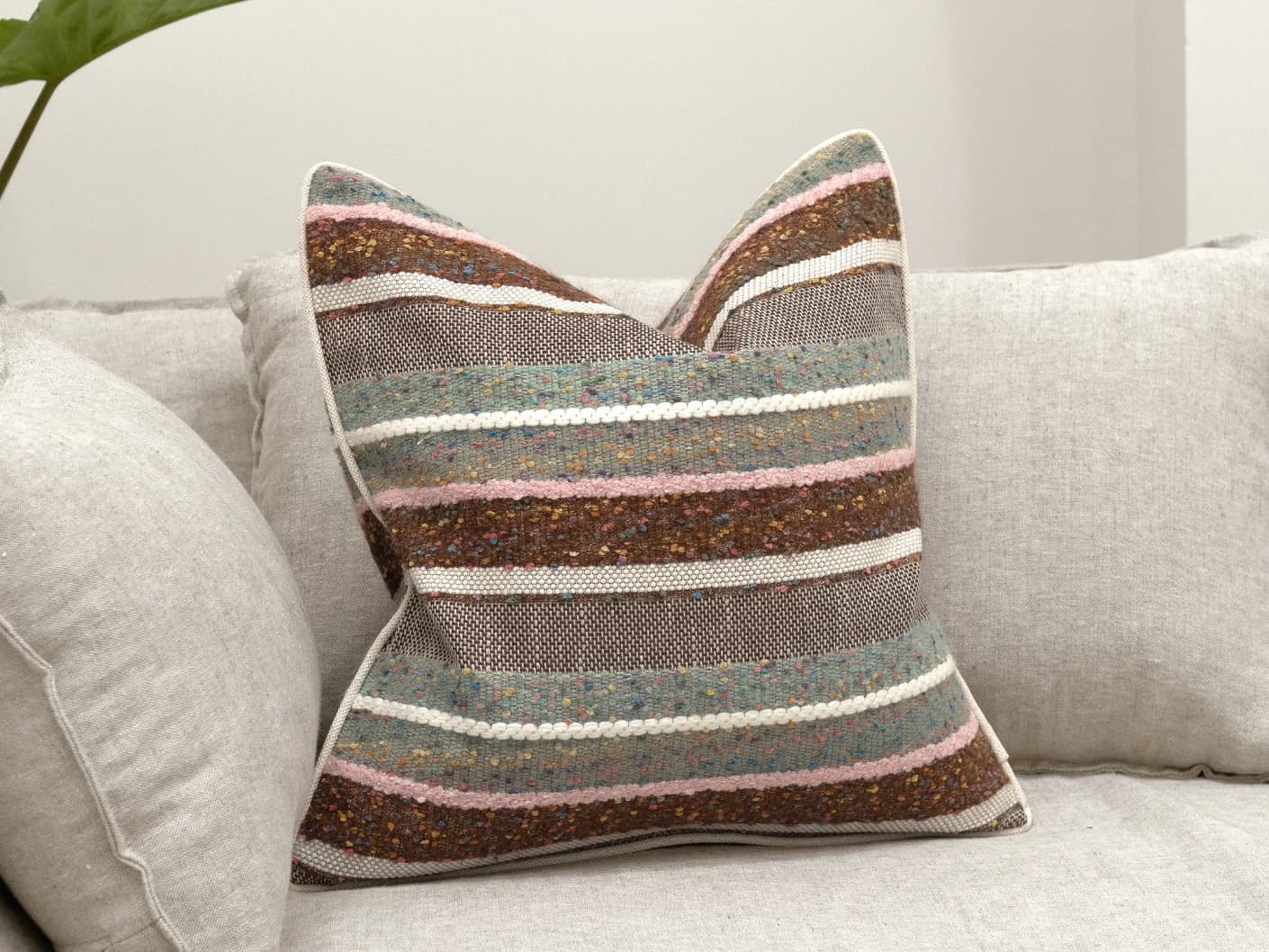 Naysa Alecia single cushions in multicolour, shown in a lifestyle front view