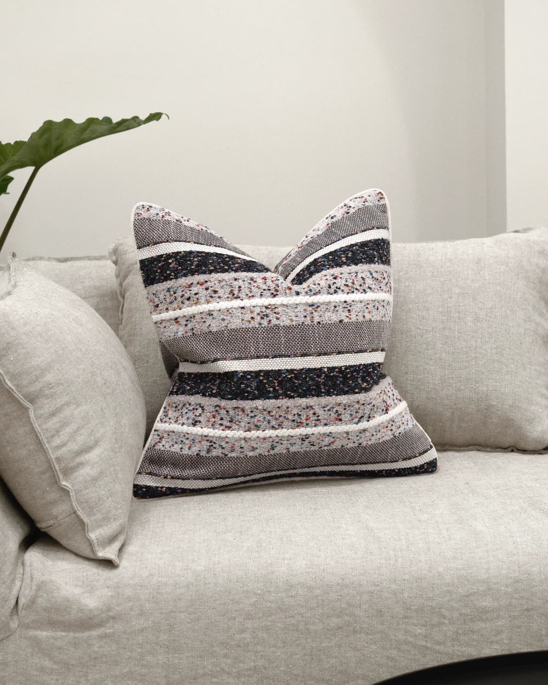 Naysa Canova cushion in multicolour, shown in a lifestyle front view as image 2