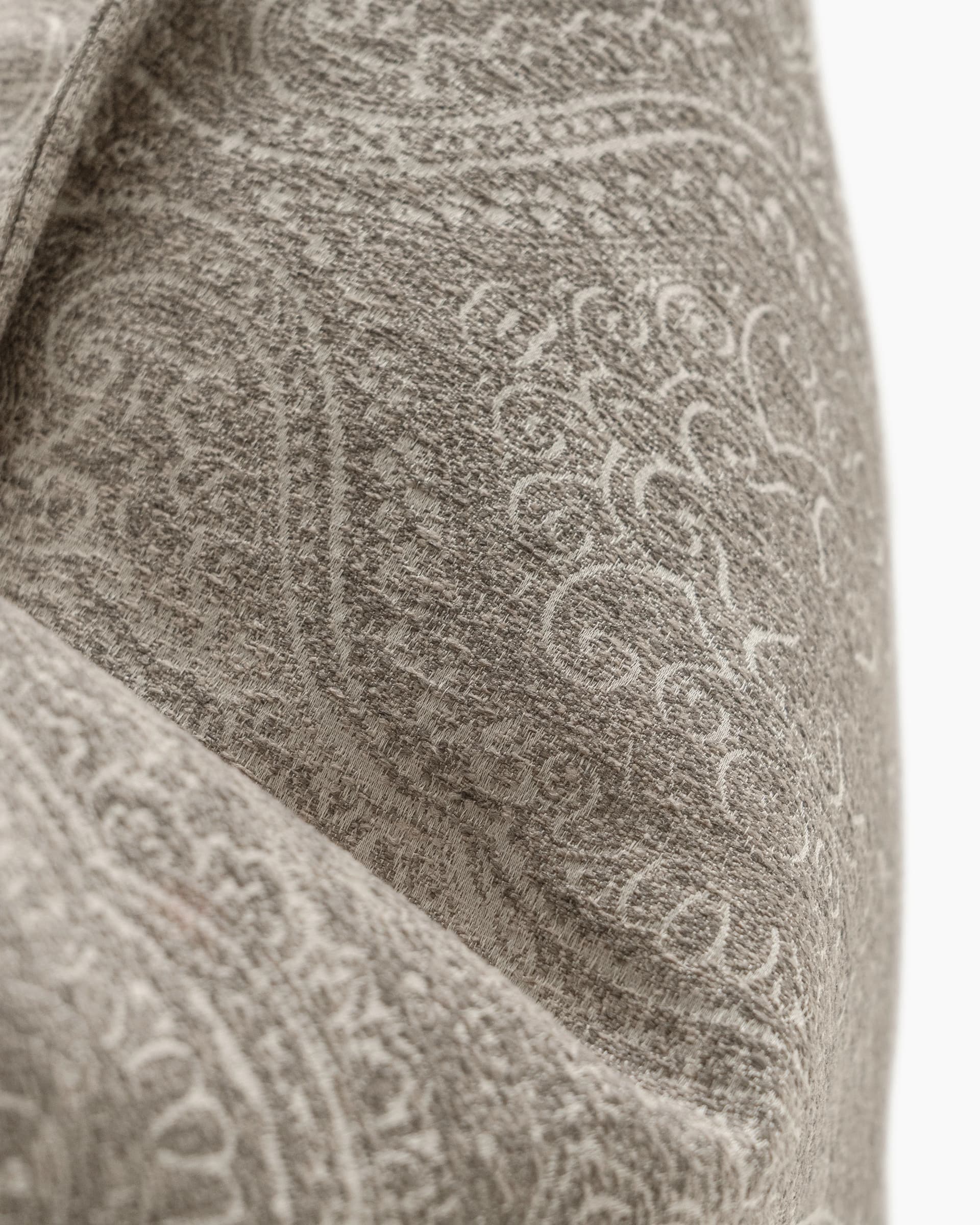 Nia Laurent cushion in taupe and grey, shown in a product close-up as image 2