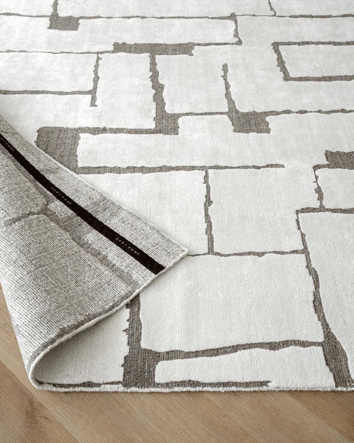 Nico Sandy carpet in ivory, grey and brown, shown in a product close-up as image 10