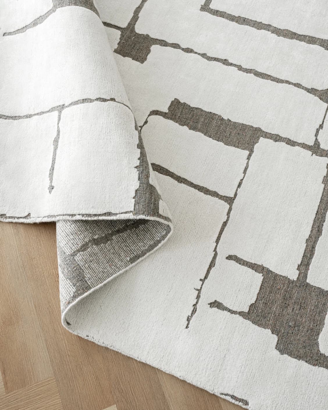 Nico Sandy carpet in ivory, grey and brown, shown in a product close-up as image 11