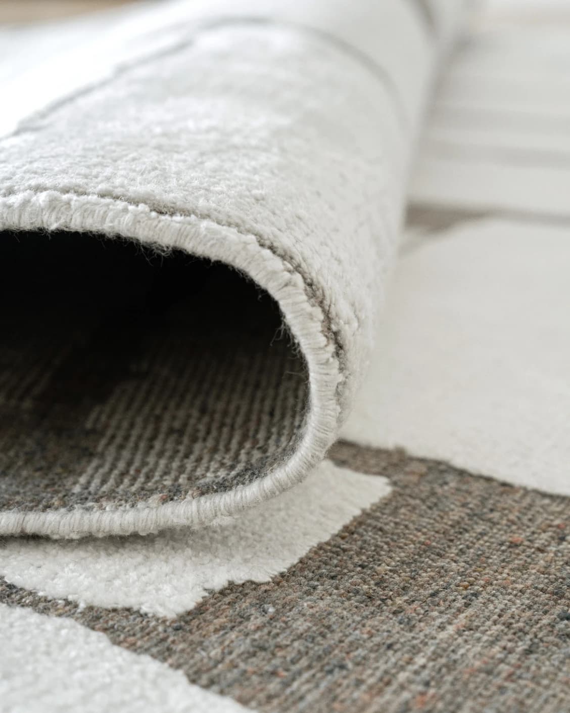 Nico Sandy carpet in ivory, grey and brown, shown in a product close-up as image 12