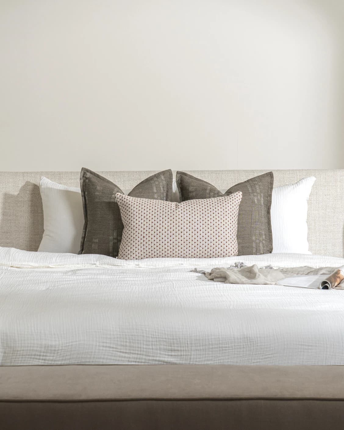Nimitha Bundle cushion in grey and beige, shown in a lifestyle front view as image 2