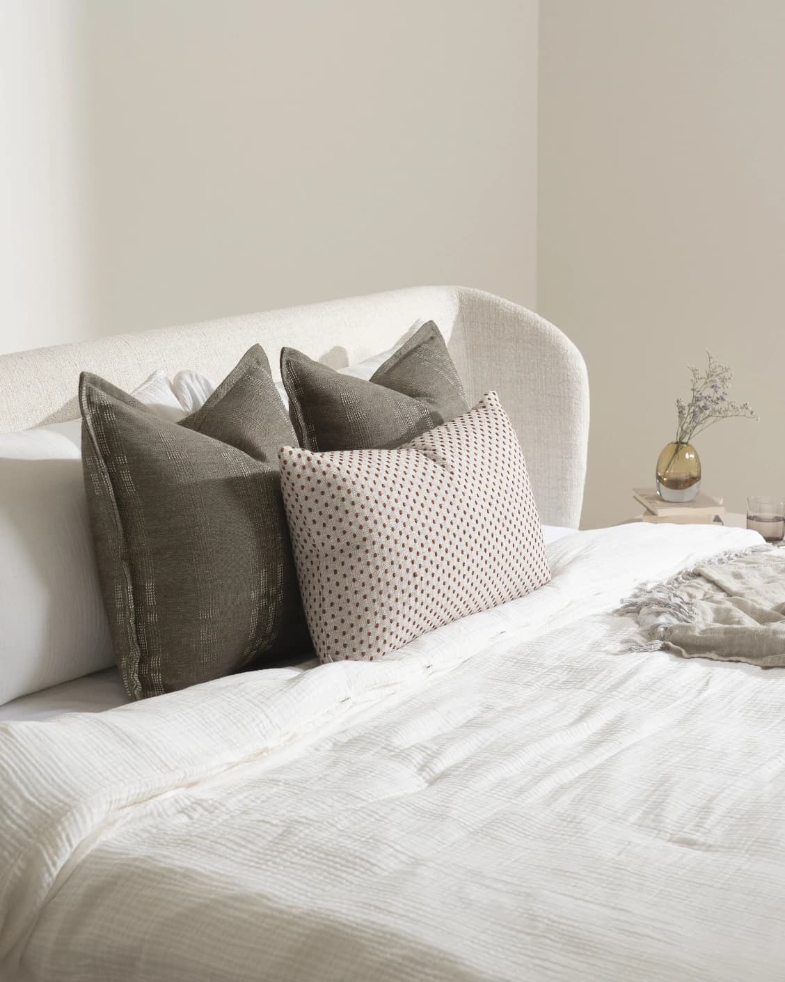 Nimitha Bundle cushion in grey and beige, shown in a lifestyle left view as image 7
