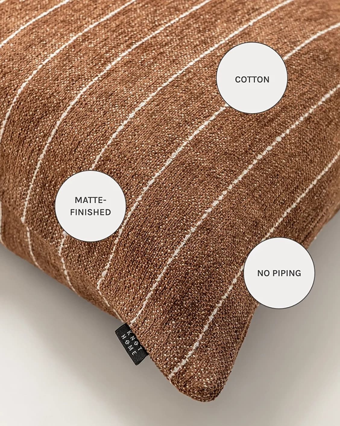 Noa Rust cushions in rust, white and brown, shown in a product close-up as image 12