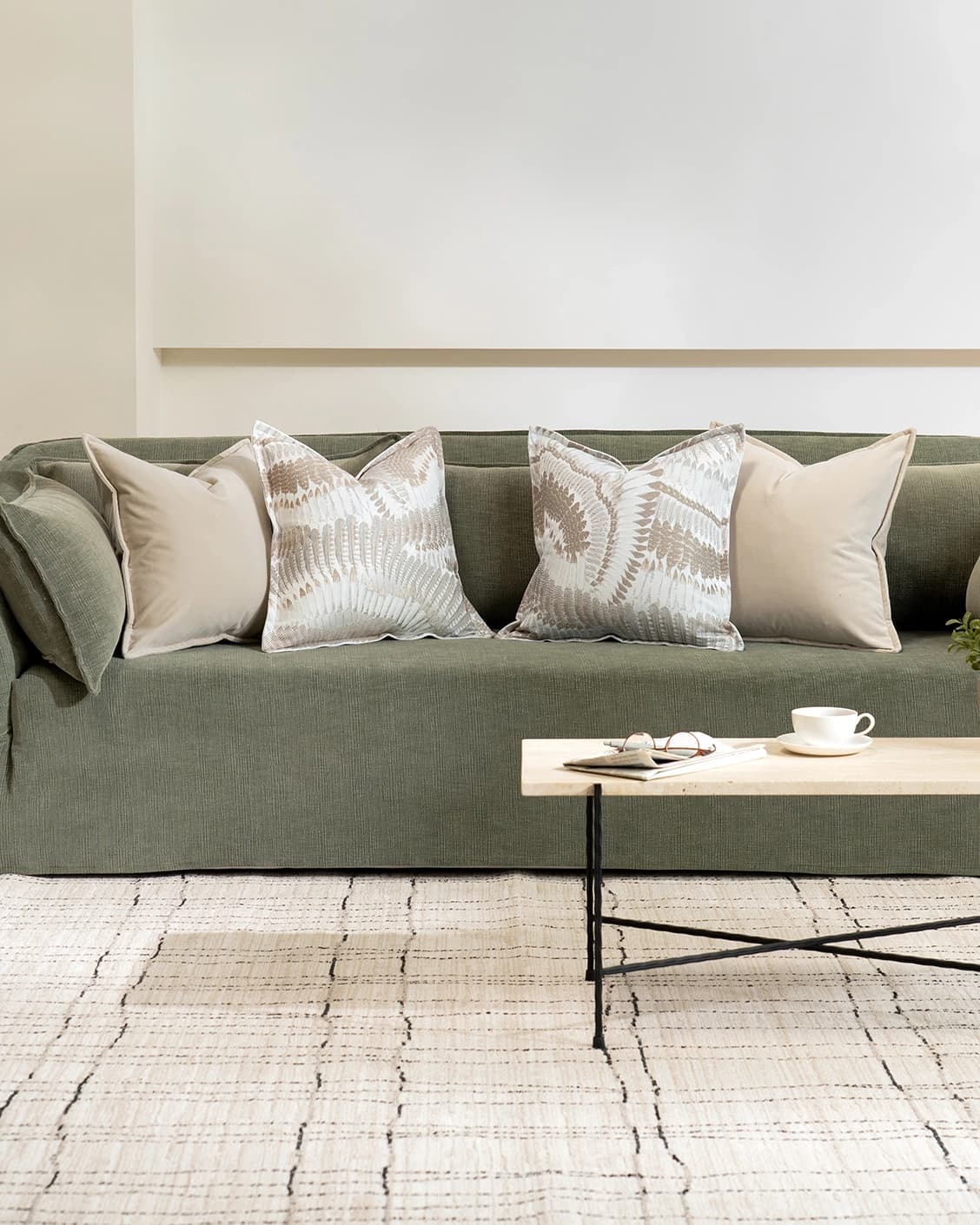 Nora Bundle cushion in beige, brown and grey, shown in a lifestyle front view as image 4