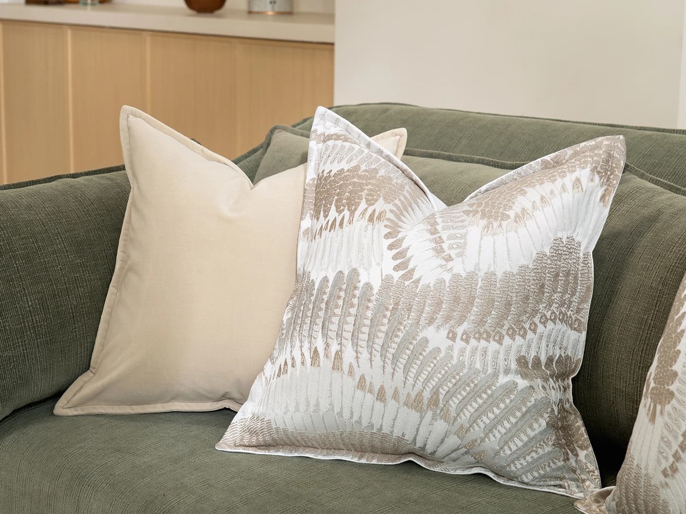 Nora Bundle cushion in beige, brown and grey, shown in a lifestyle right view as image 2