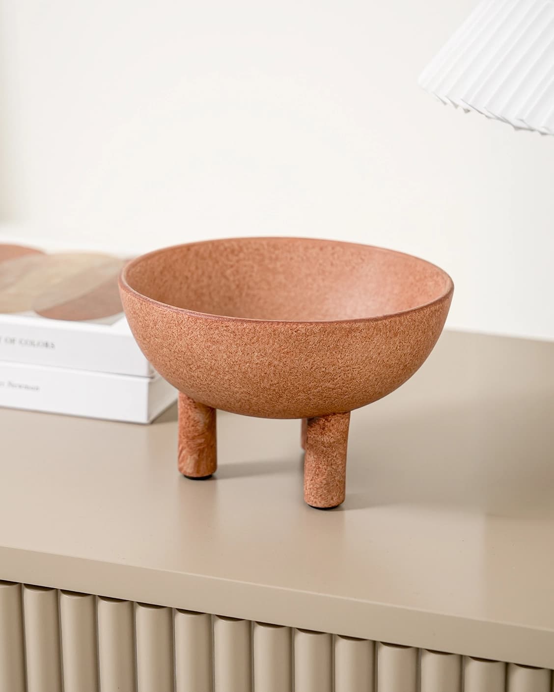 Nuva Terra bowls in orange, shown in a lifestyle front view