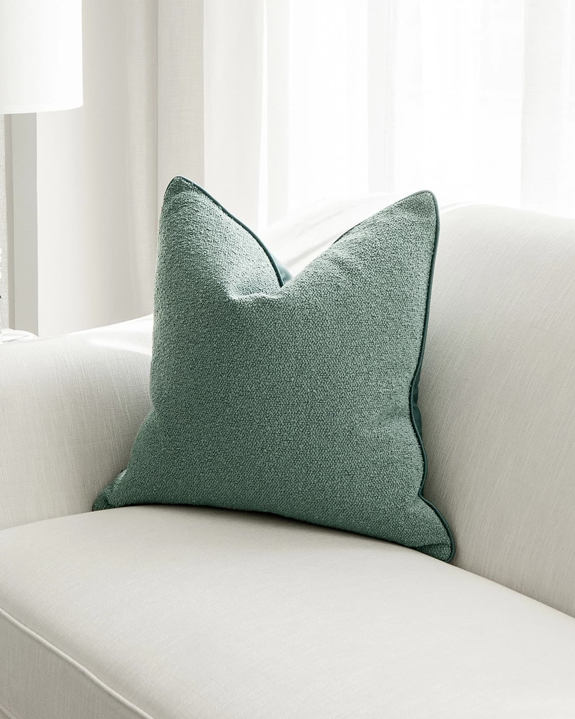 Oliver Sage cushion in green, shown in a lifestyle right view as image 2