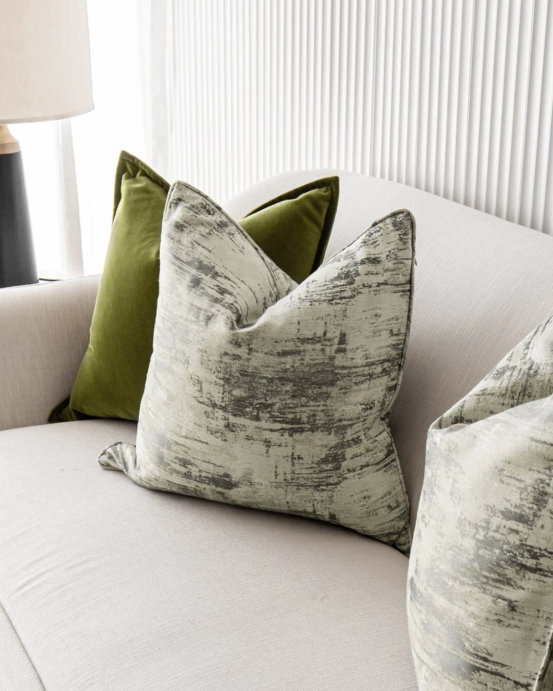 Omarie Bundle cushion in green, grey and white, shown in a product front view as image 5