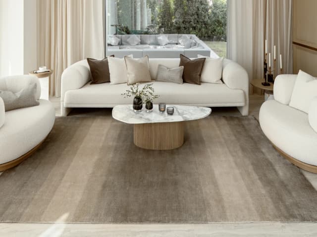 Oscar Ashton carpets in beige, shown in a lifestyle close-up top view as image 1
