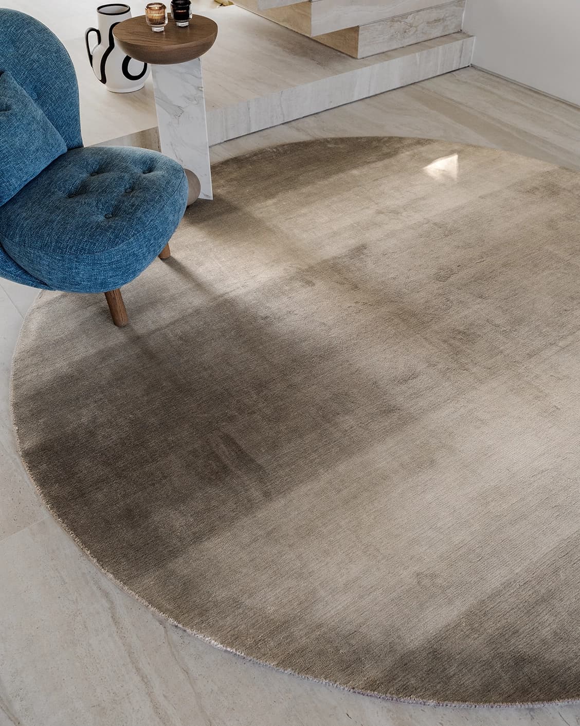 Oscar Ashton carpets in beige, shown in a lifestyle close-up top view as image 1