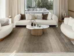 Oscar Ashton carpet in beige, shown in a lifestyle front view