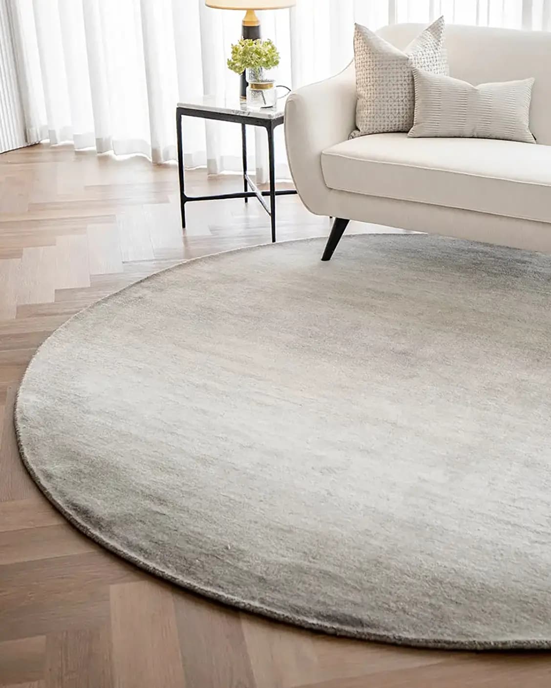 Oscar Dune Round carpet in dune and beige, shown in a lifestyle right view as image 2