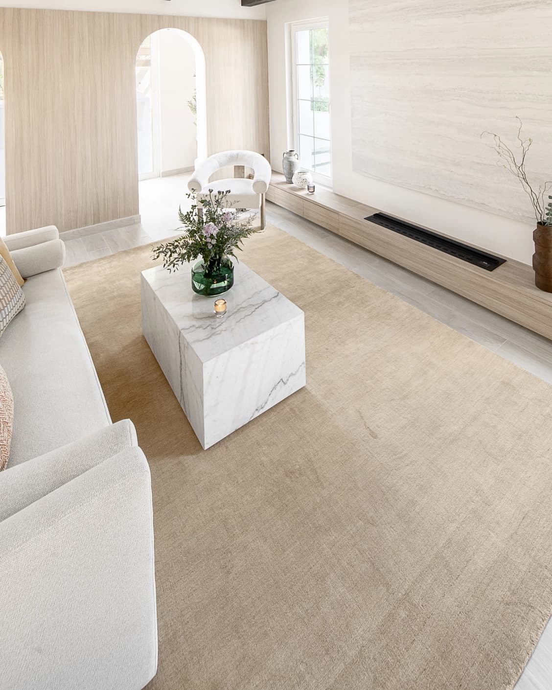Oscar Sandy carpet in beige, shown in a lifestyle left view as image 7