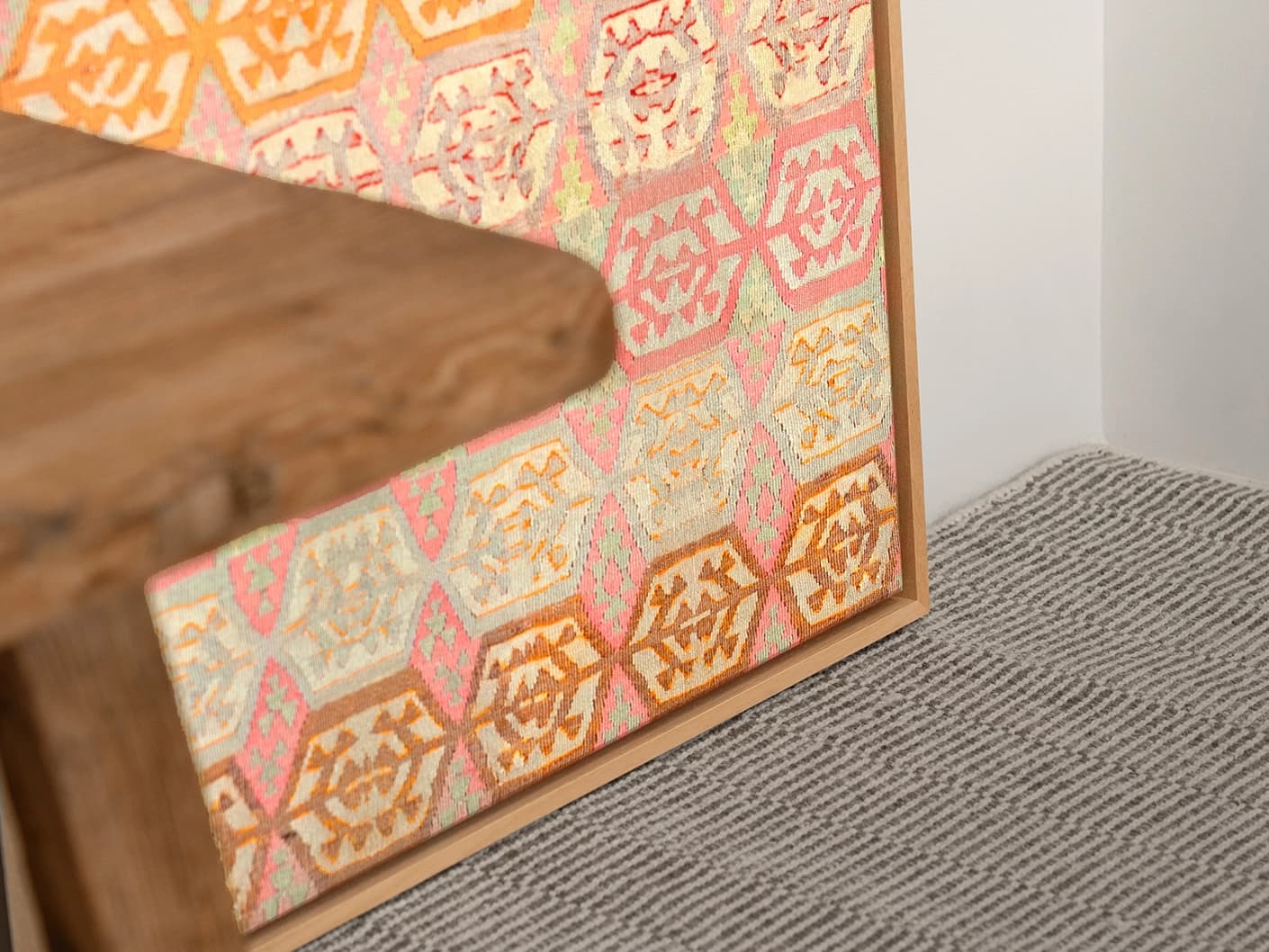 Pastels canvas in pink, beige and orange, shown in a lifestyle close-up as image 1