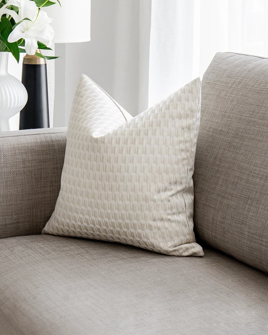 Paul Bianca cushion in white and beige, shown in a lifestyle as image 2