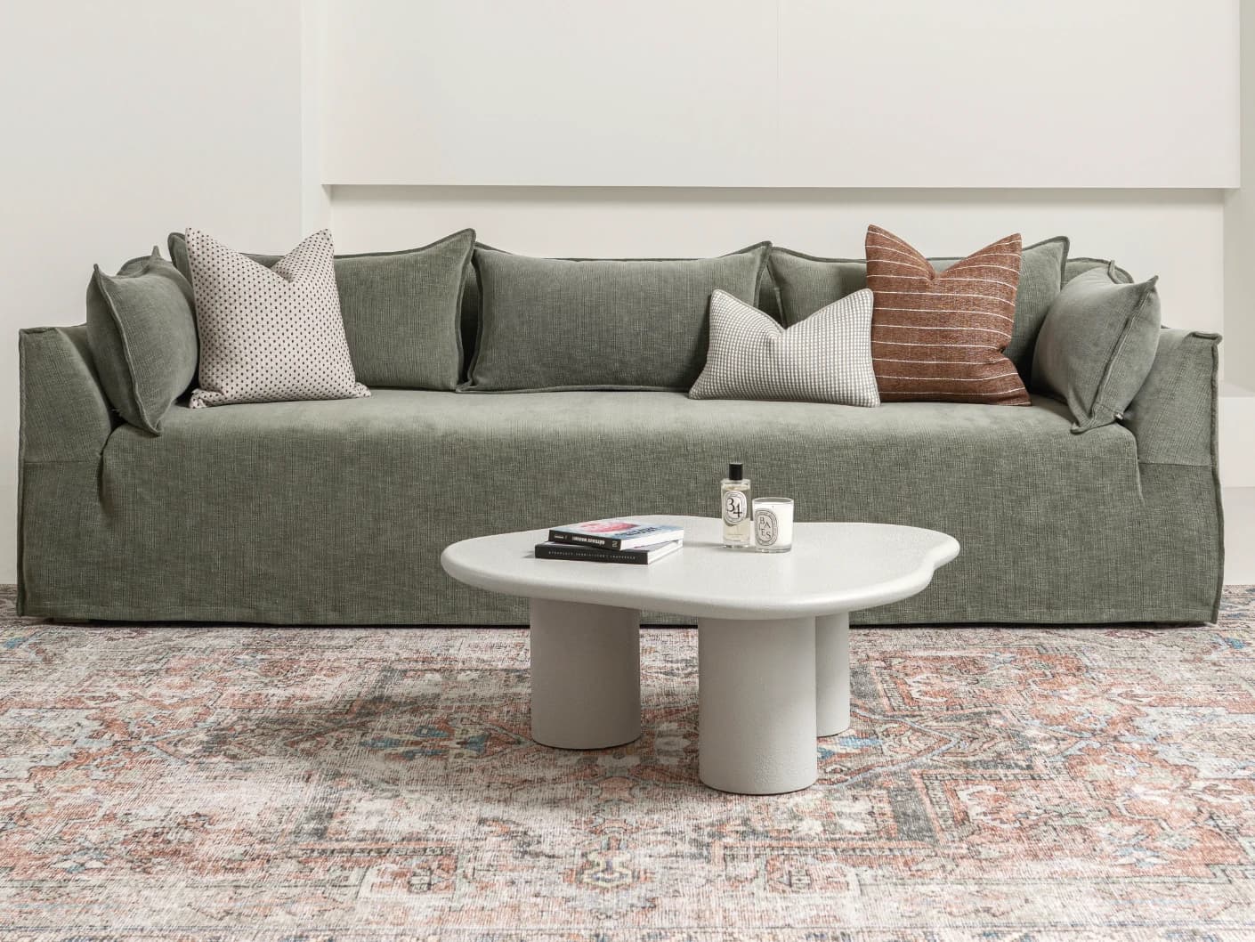 Pienza coffee table in soft ivory and stone, shown in a lifestyle front view as image 1