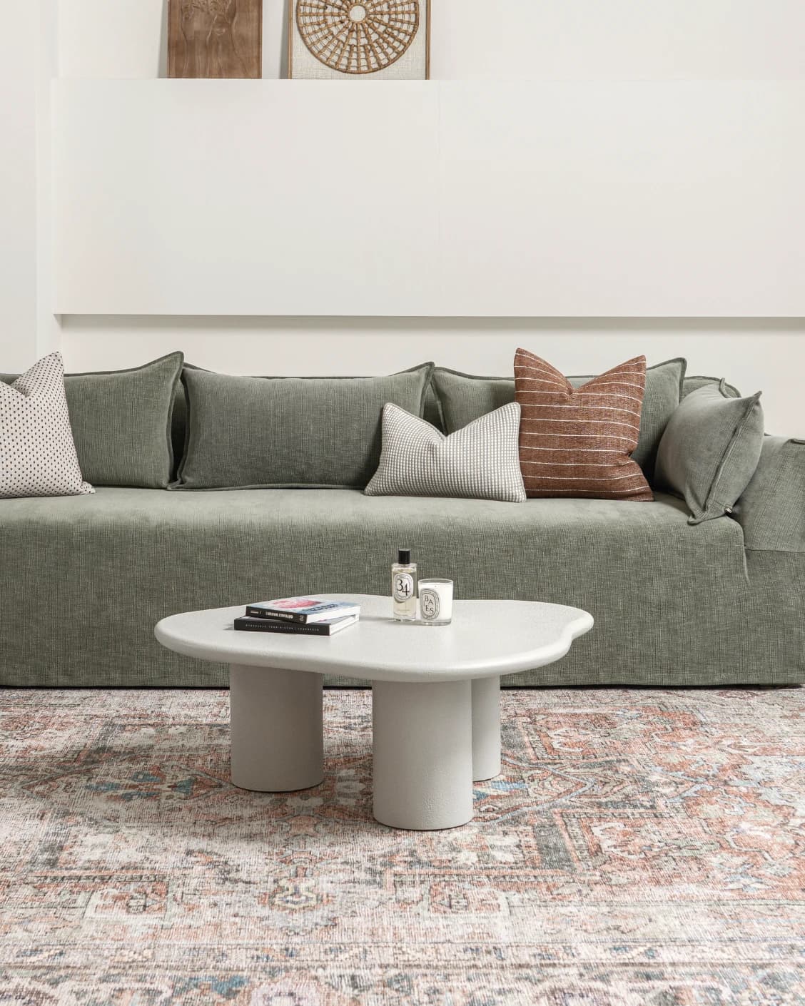 Pienza coffee table in soft ivory and stone, shown in a lifestyle front view as image 2