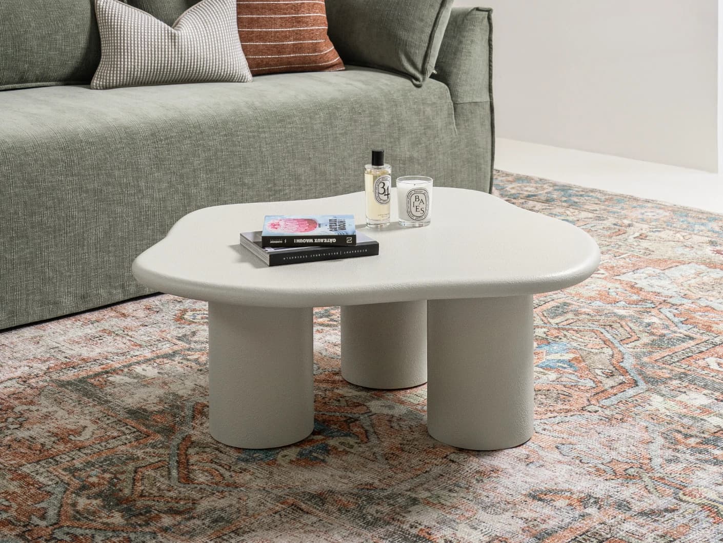 Pienza coffee table in soft ivory and stone, shown in a lifestyle left view as image 2