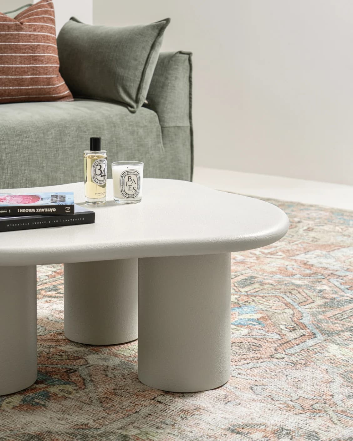 Pienza coffee table in soft ivory and stone, shown in a lifestyle left view as image 3