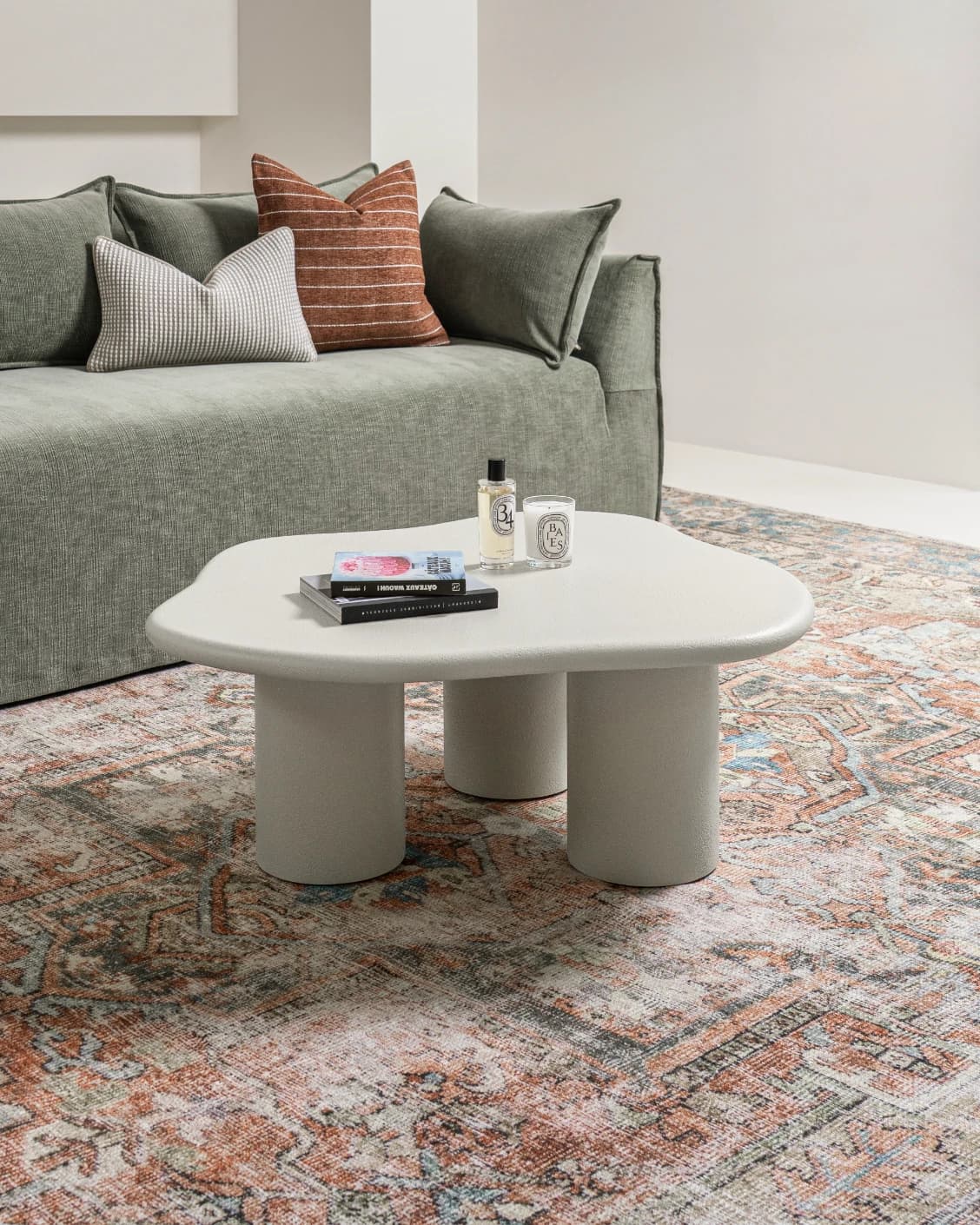 Pienza coffee table in soft ivory and stone, shown in a lifestyle left view as image 2