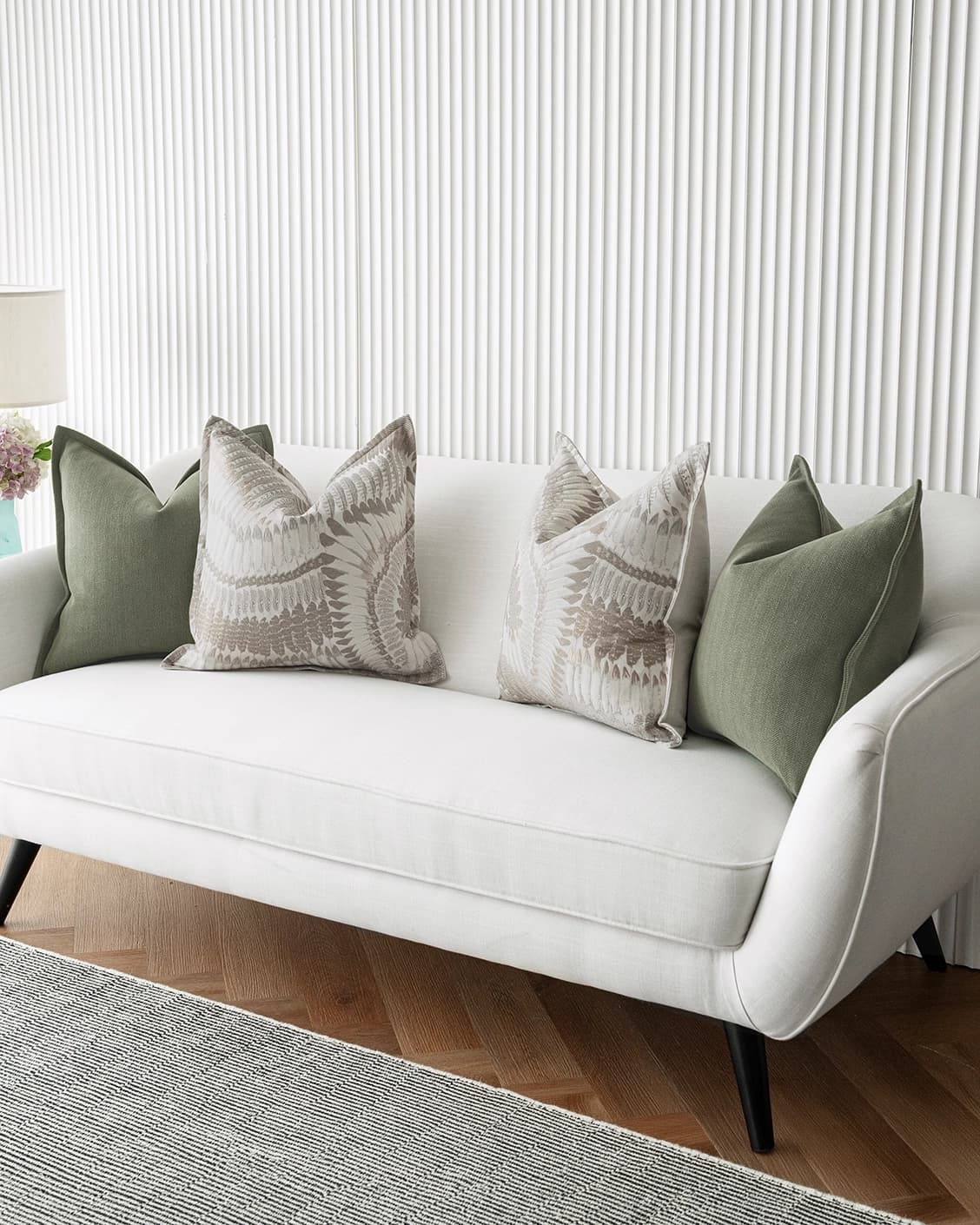 Quentin Bundle cushion in green, brown and grey, shown in a lifestyle right view as image 2
