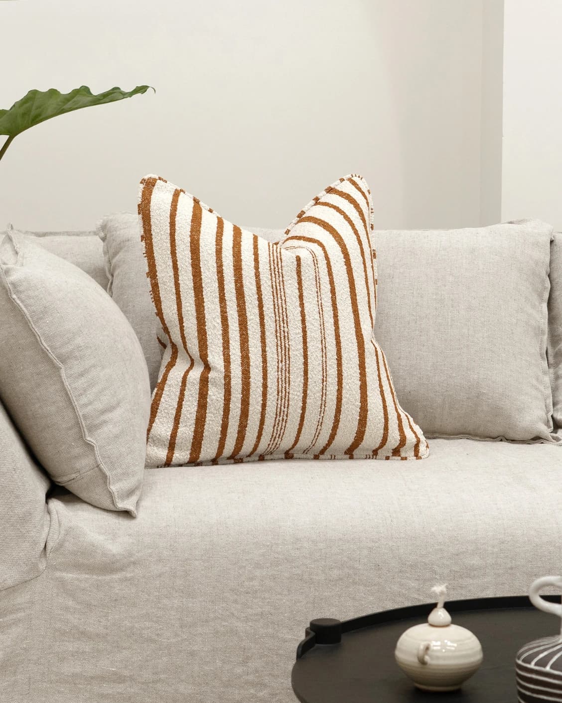 Raya Hodler cushion in ivory, shown in a lifestyle front view as image 4