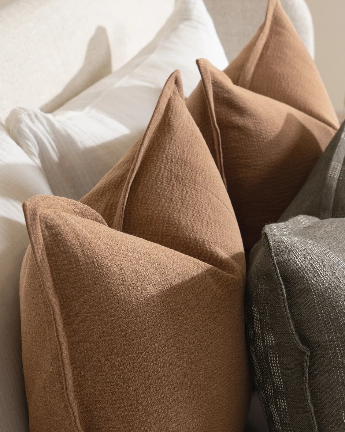 Rayan Bundle cushion in rust, shown in a lifestyle close-up top view as image 6