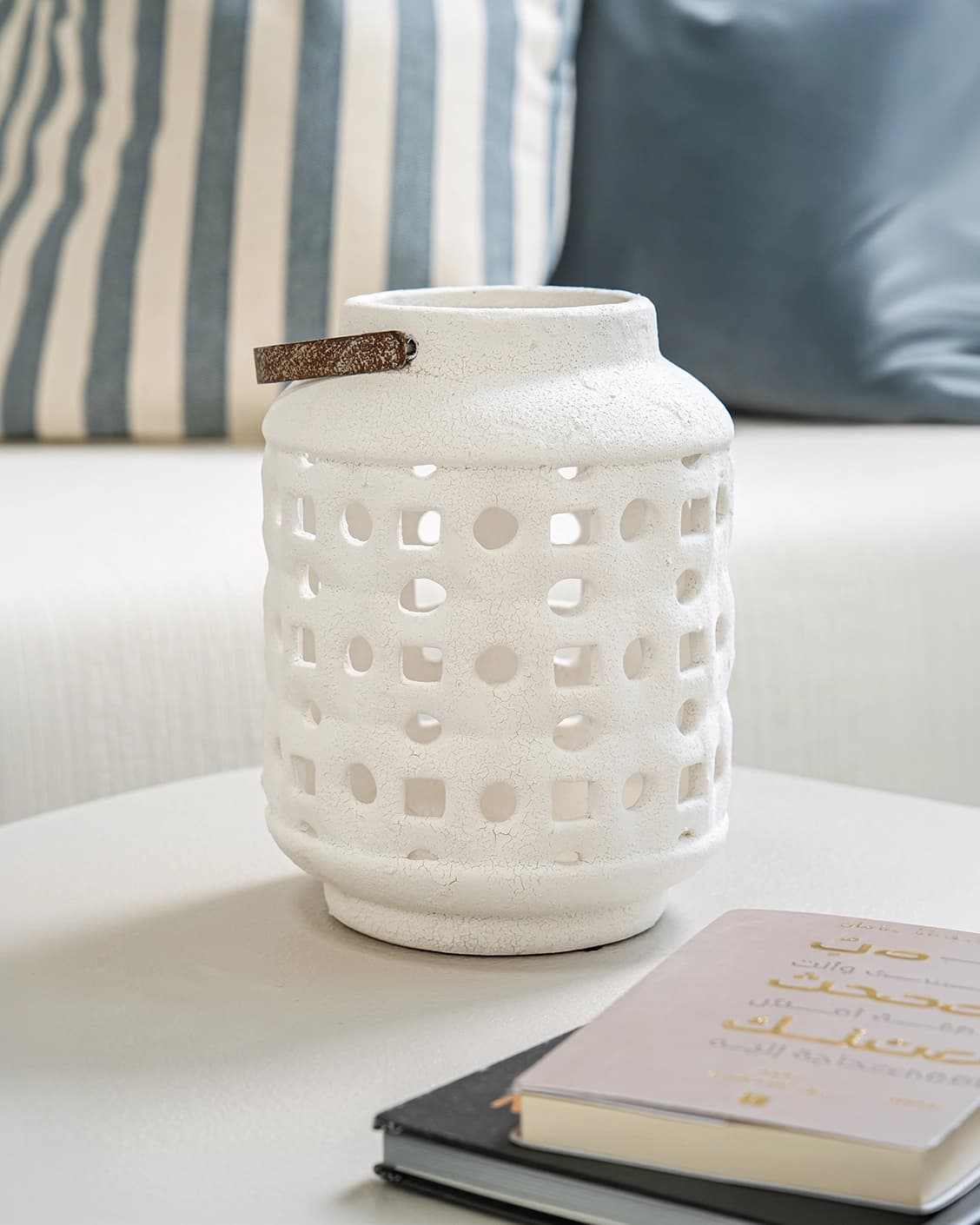 Reba Terra candle holders in soft ivory and ivory, shown in a lifestyle front view as image 2
