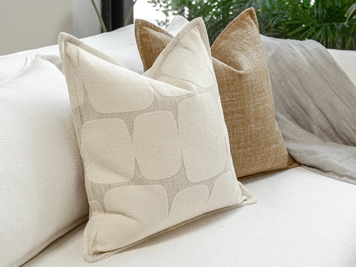 Rennie Bundle bundle cushions in brown and white, shown in a product front view