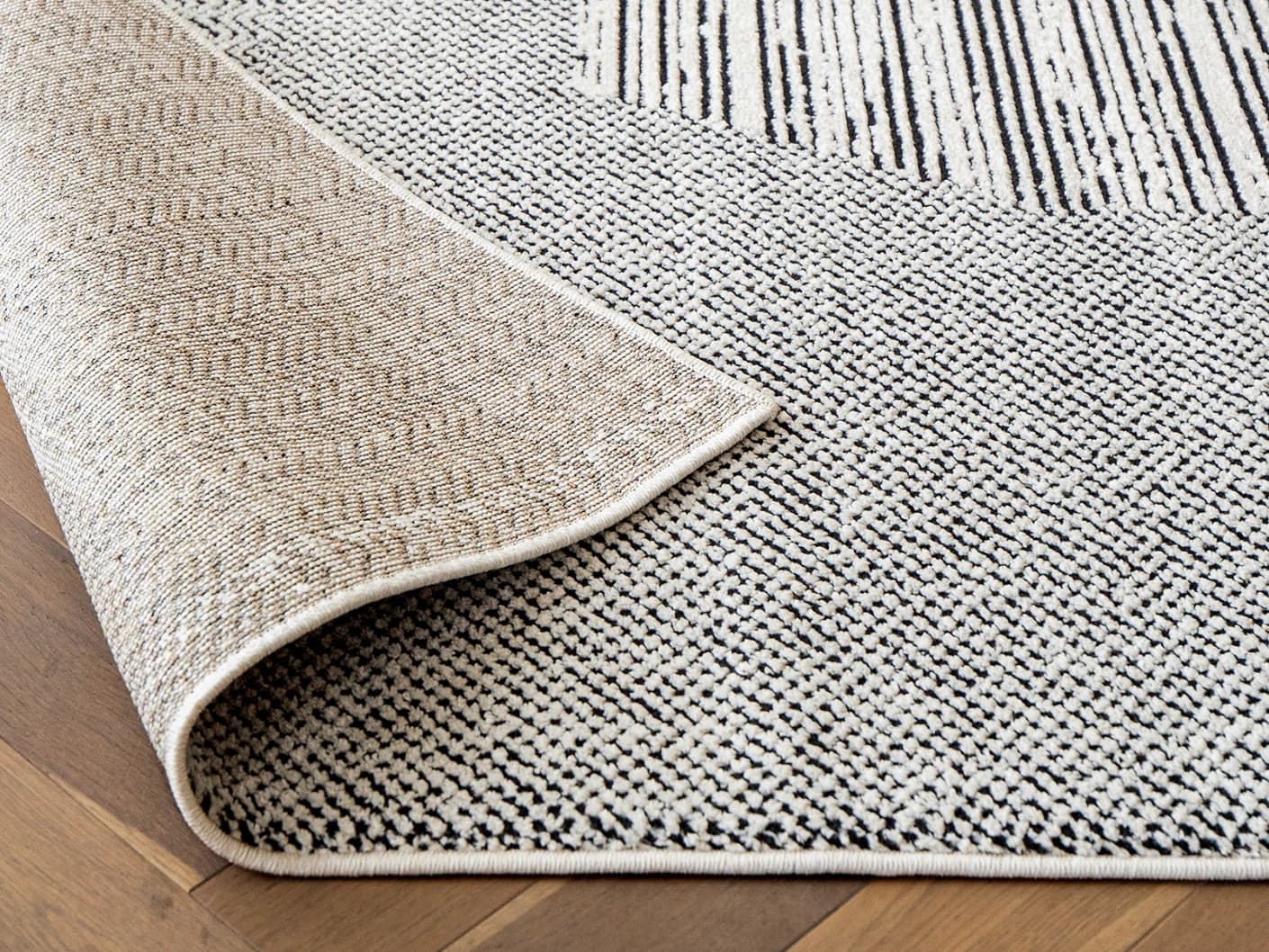 Renzo Dusty Runners carpets in black and white, shown in a product close-up view