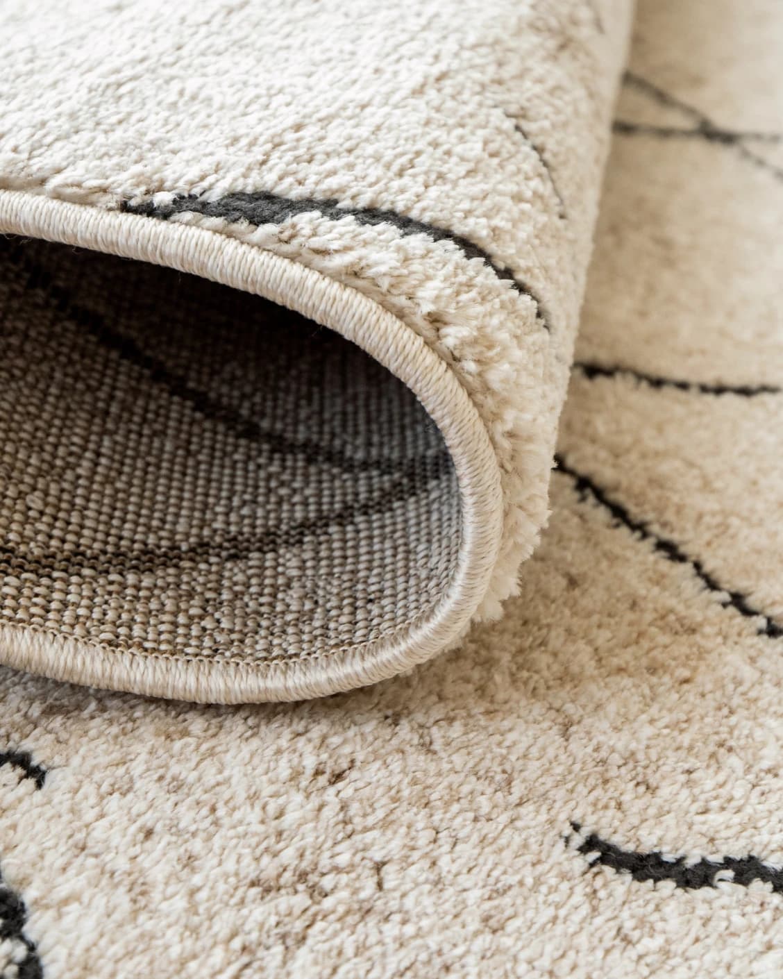 Renzo Ebony carpet in beige, shown in a product close-up as image 11