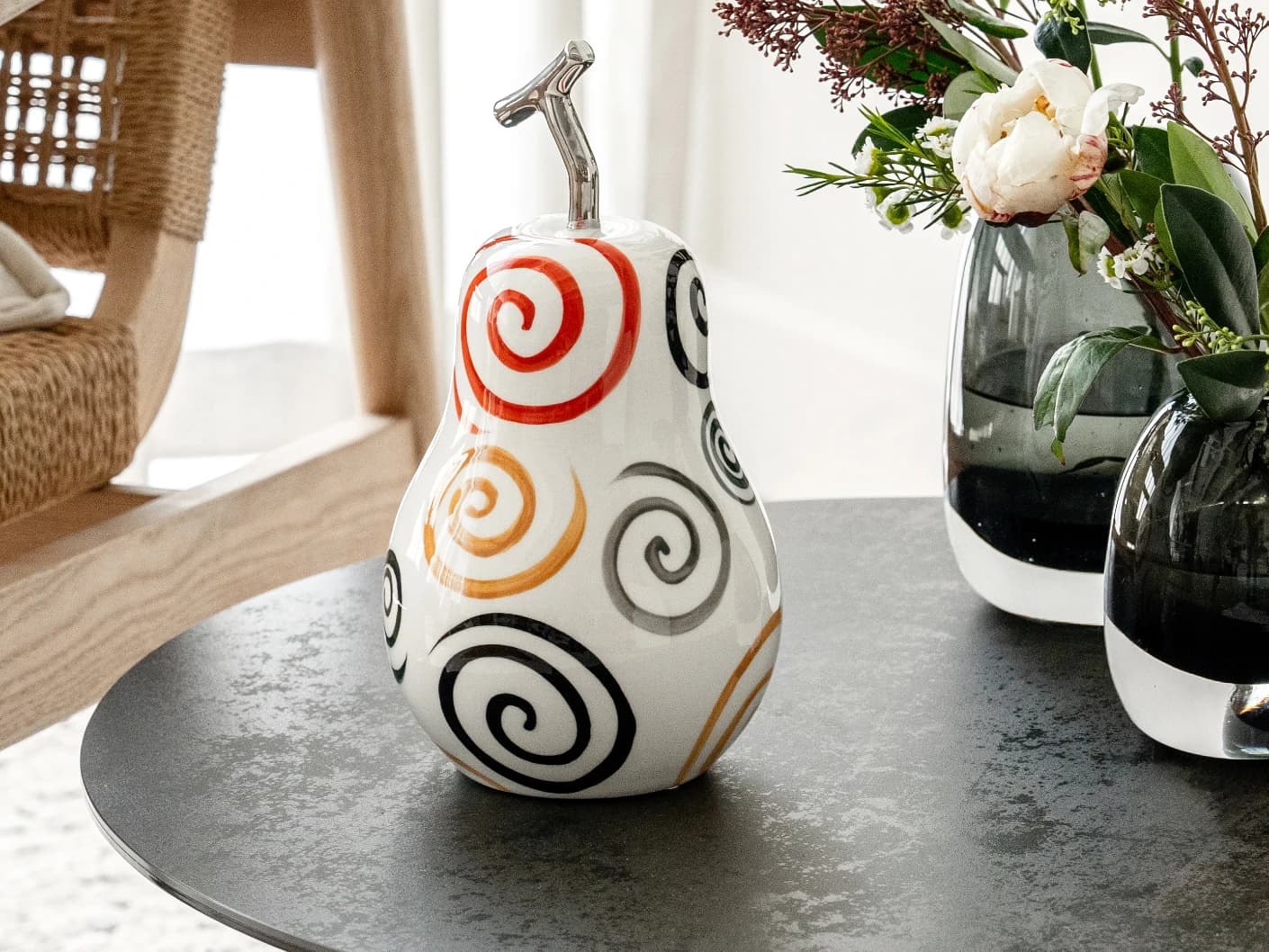 Rhea Arneson statues and sculptures in white, black and red, shown in a lifestyle right view