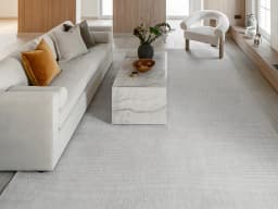 Rik Dune carpet in dune and grey, shown in a lifestyle front view