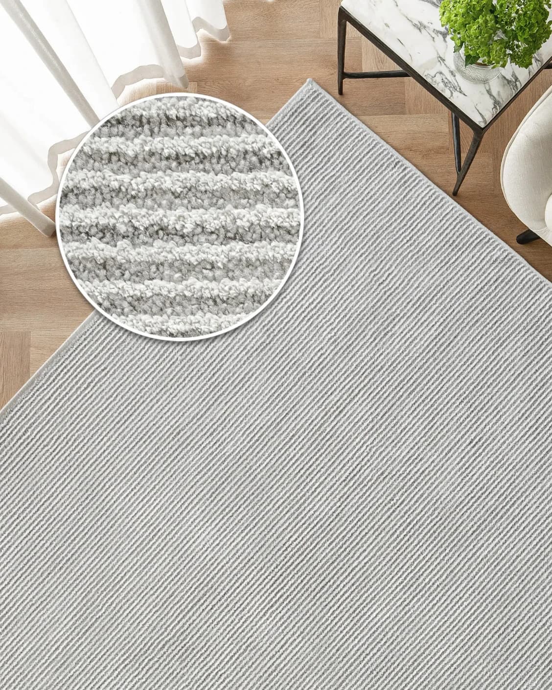 Rik Dune carpet in grey, shown in a lifestyle top view as image 2