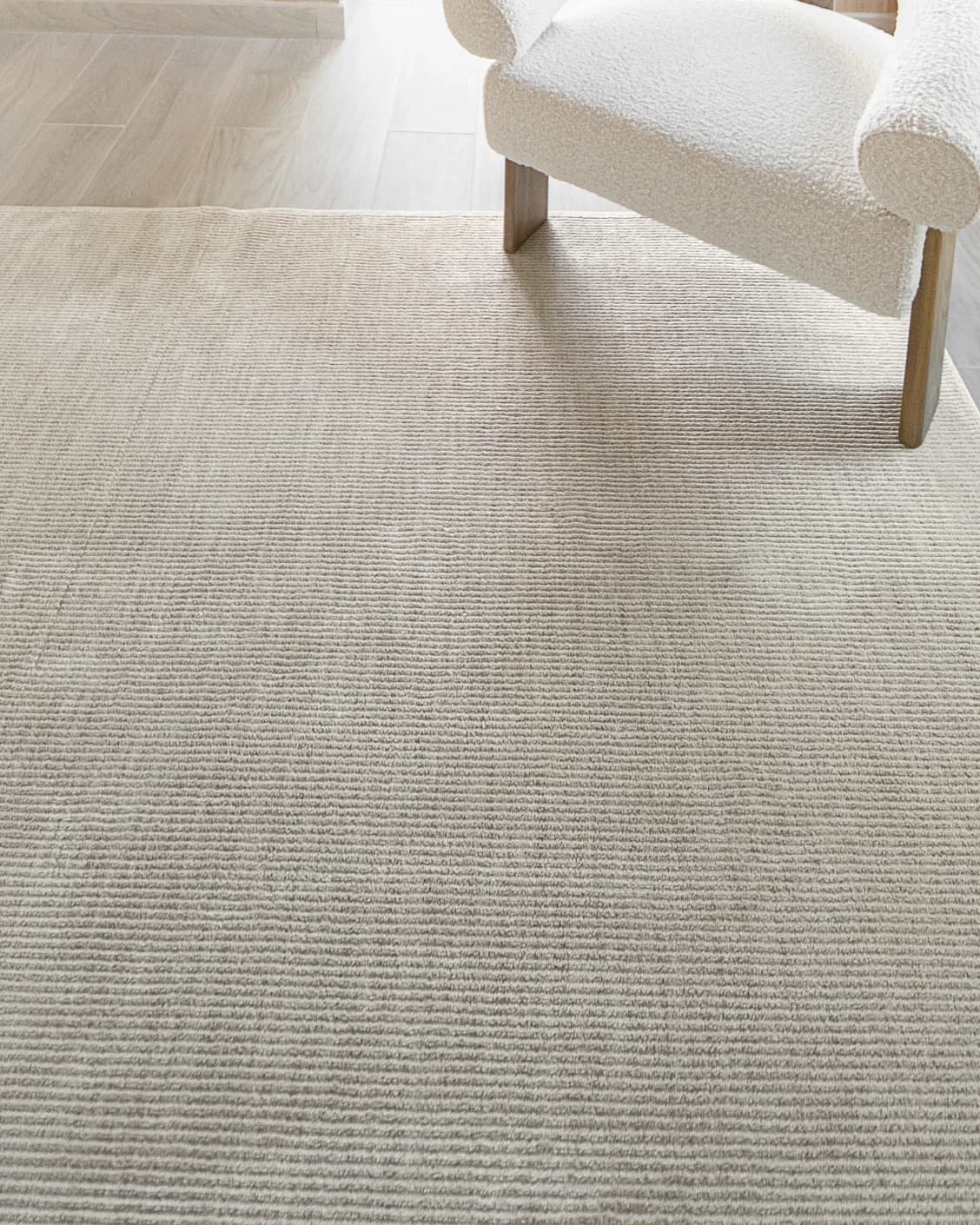 Rik Sandy carpet in beige, shown in a lifestyle close-up top view as image 4