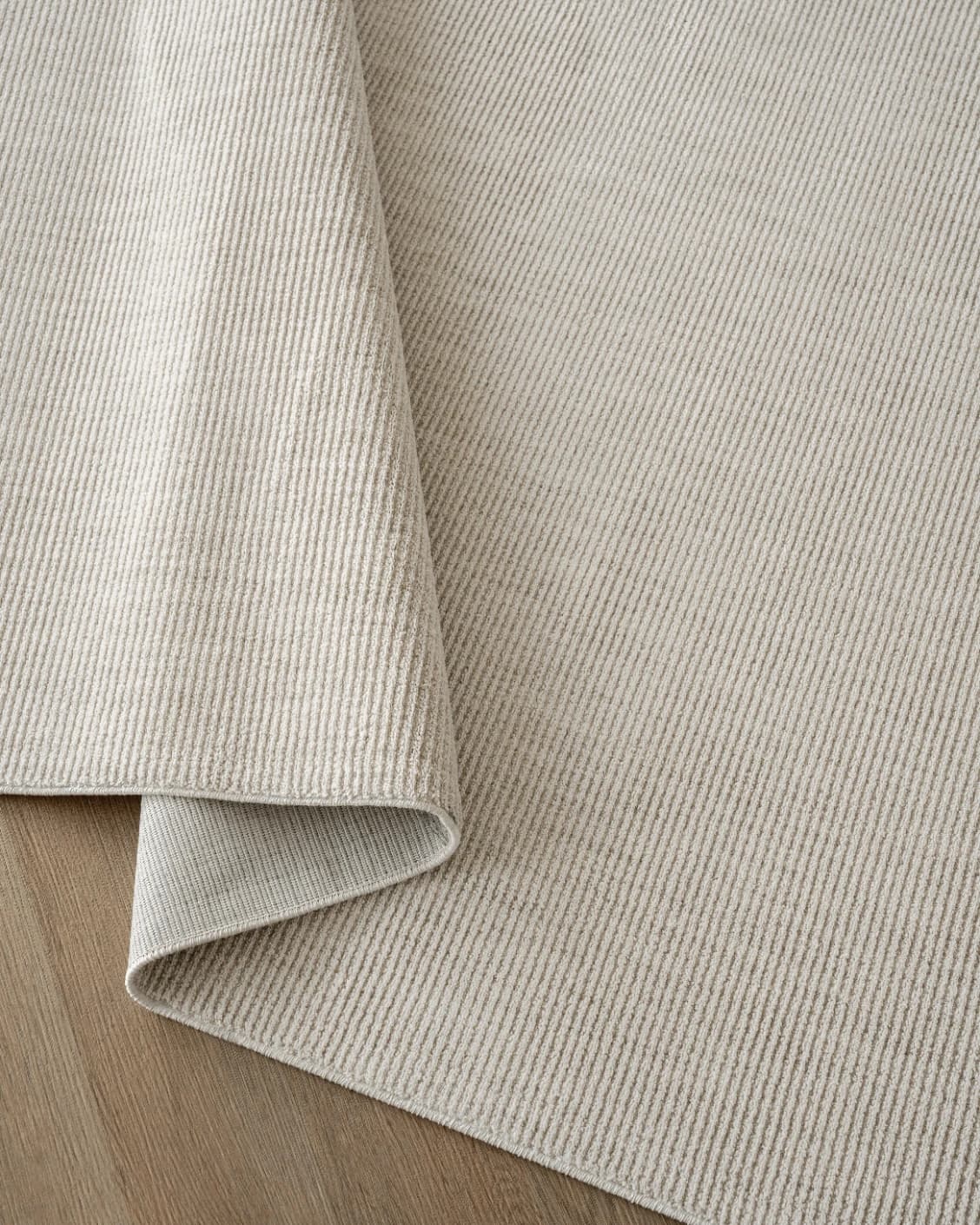 Rik Sandy carpet in beige, shown in a product close-up top view as image 8