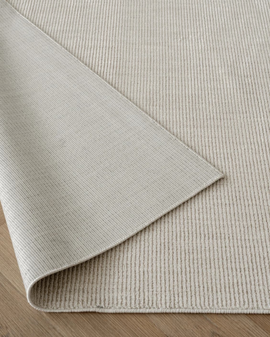Rik Sandy carpet in beige, shown in a product front view as image 9