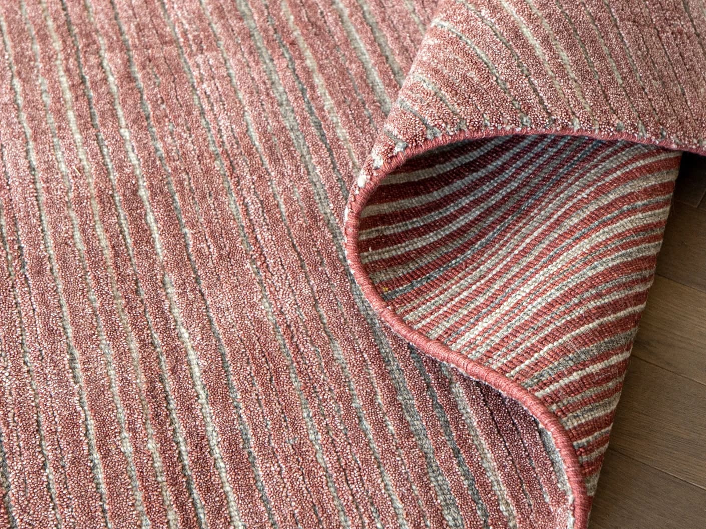 Rita Rosso II carpets in red, shown in a product view