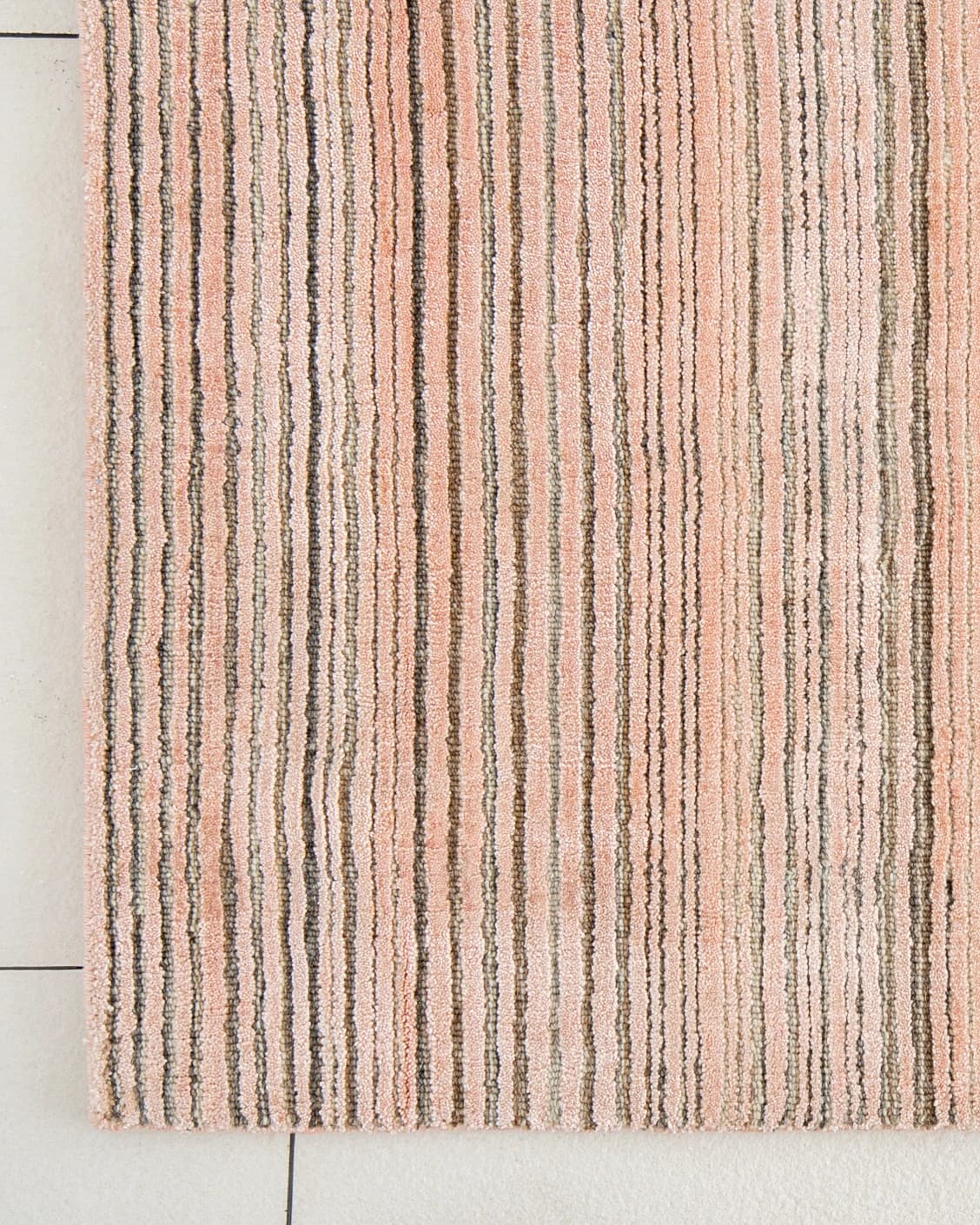 Rita Rosso carpets in pink, shown in a lifestyle top view as image 3