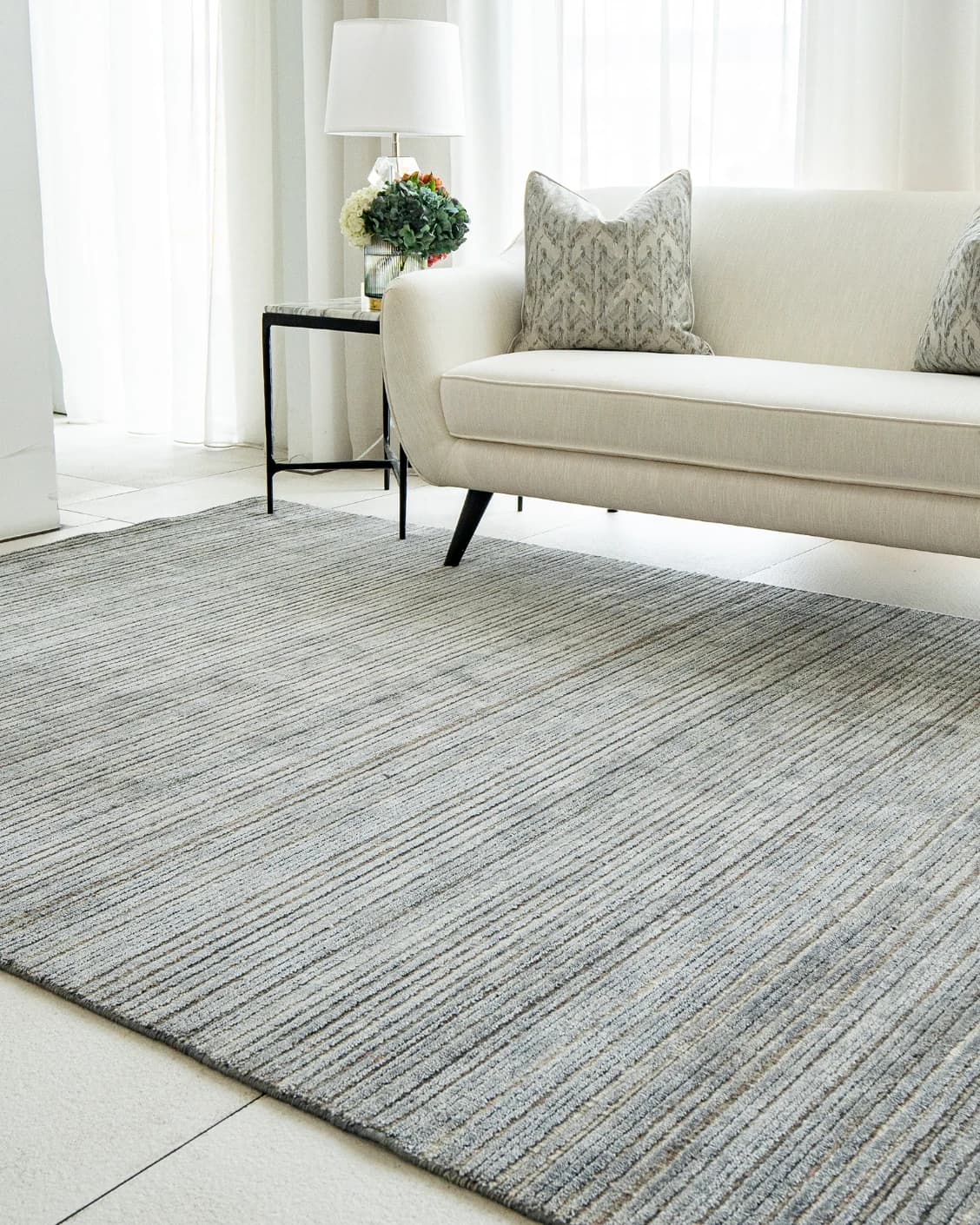 Rita Stevens carpet in grey, shown in a lifestyle right view as image 5