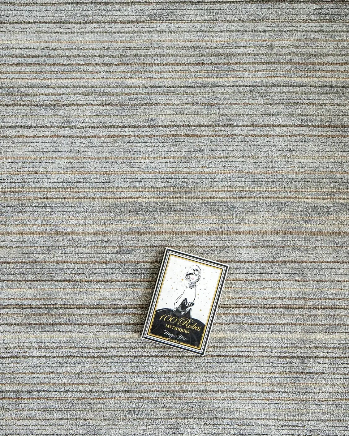 Rita Stevens carpet in grey, shown in a lifestyle top view as image 6